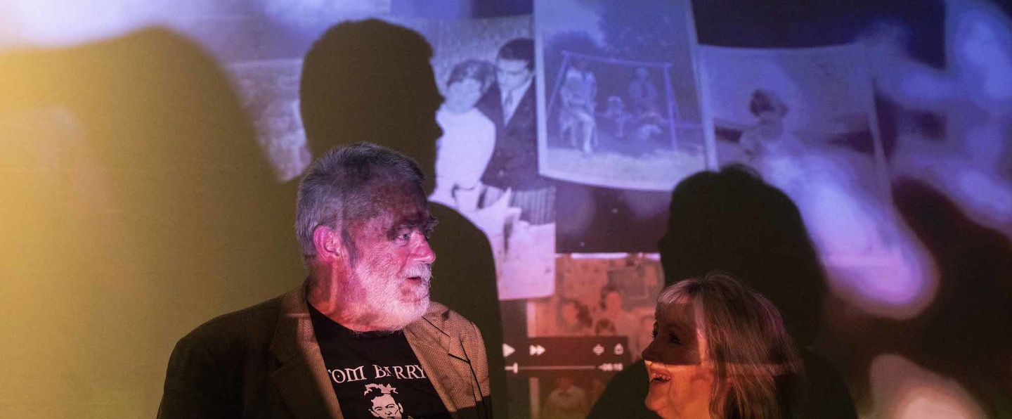 Poet Gerry Murphy and artist Colette Nolan in front of film-poem The Key Was Always In The Door