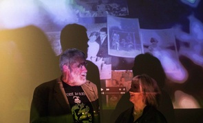 Poet Gerry Murphy and artist Colette Nolan in front of film-poem The Key Was Always In The Door