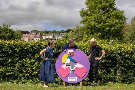 Glucksman Director Fiona Kearney, Artist Chris Judge and Glucksman Senior Curator Tadhg Crowley with Up Cycling! artwork, 2024. Photo by Clare Keogh.
